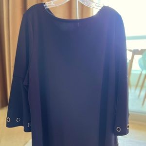 New IC Collection tunic in black with grommet detailing on sleeves and pockets.